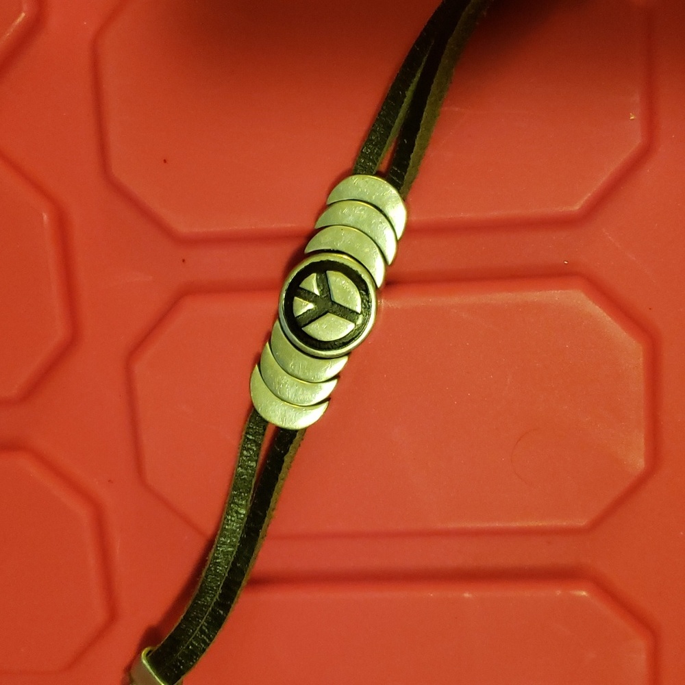 peace silver and black leather magnetic close bracelet